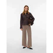 Dark brown peplum blouse with long sleeves and button-down front paired with vero moda beige polyester slip-on trousers