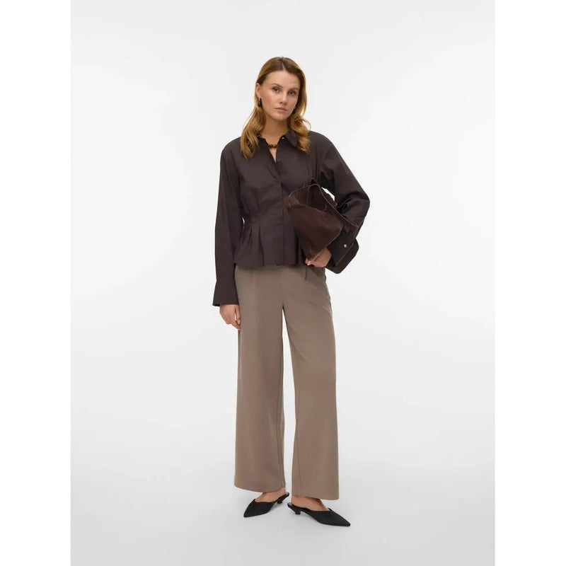 Dark brown peplum blouse with long sleeves and button-down front paired with vero moda beige polyester slip-on trousers