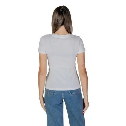Back view of a gray t-shirt paired with blue jeans showcasing Calvin Klein Jeans design