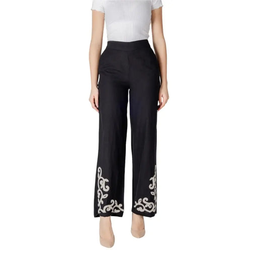 Black high waisted Vila Clothes cotton linen viscose trousers with white ornate embroidery on the cuffs