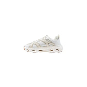 White and beige women’s athletic slip-on sneakers with intricate lacing and textured heel