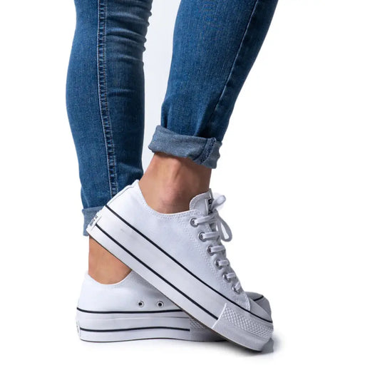 White canvas platform sneakers with black stripes and laces from Converse Women Black Textile Lace Up Sneakers