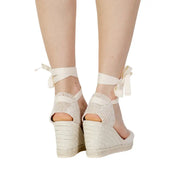 Cream-colored espadrille wedge sandals with woven texture and ankle ties in white cotton size 6.5 for women