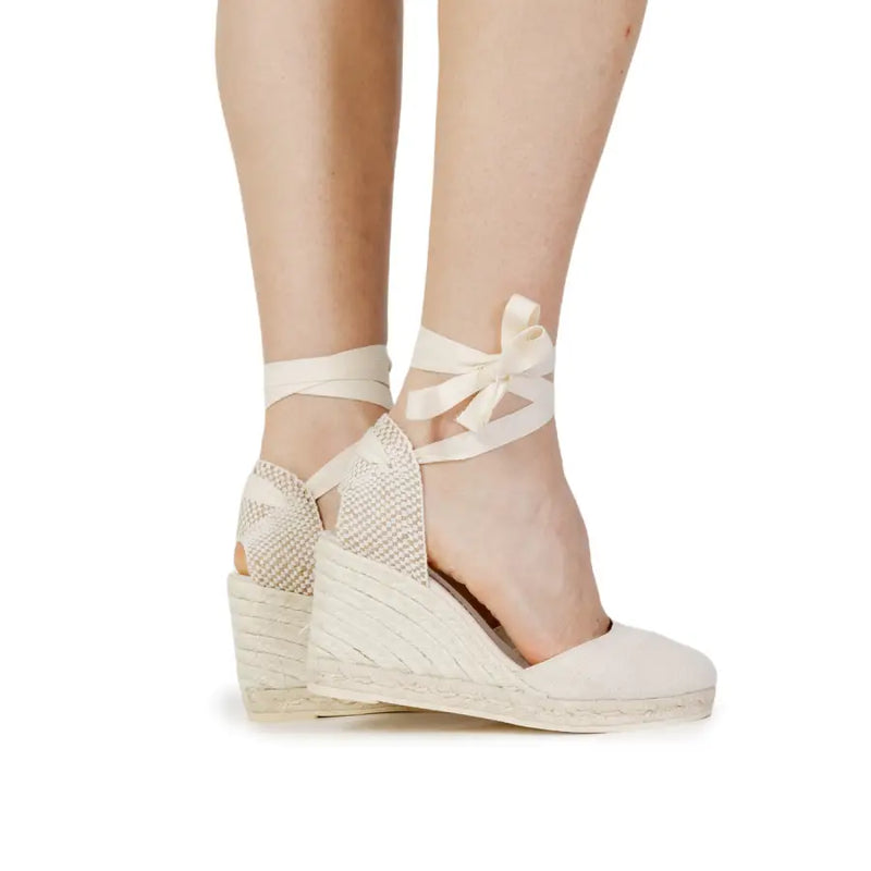 Cream-colored white cotton espadrille wedge sandals with woven jute soles and satin ankle straps size 6.5