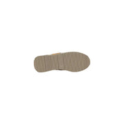 Tan rubber sole with a textured ribbed pattern on the white and gold platform sneaker