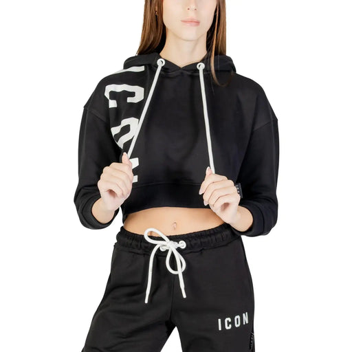 Black cropped hoodie with white drawstrings and bold sleeve lettering on women’s white cotton blend sweatshirt
