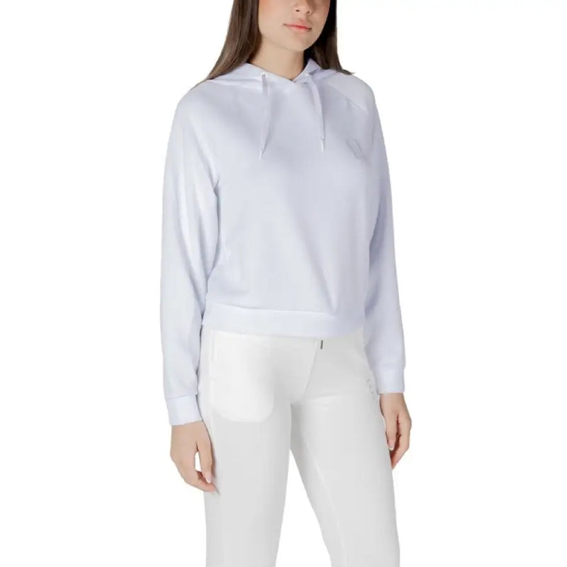White hooded sweatshirt and leggings set displayed in a product image