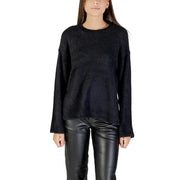 Women wearing black long-sleeved fluffy sweater and leather pants for fall winter fashion