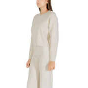 White long sleeve round neck knit sweater for women in cream-colored ribbed knit fabric with crop top style