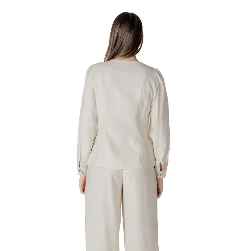 Beige long-sleeved viscose blouse for women with puffed shoulders and subtle side seam detailing