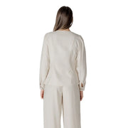 Beige long-sleeved viscose blouse for women with puffed shoulders and subtle side seam detailing