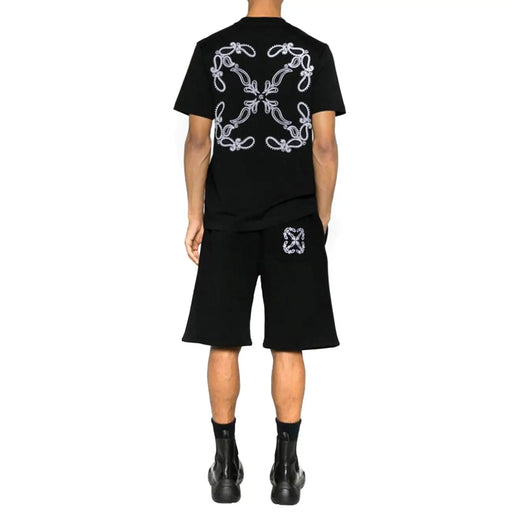 Off-white hommes t-shirt vue de dos d'un t-shirt noir à manches courtes orné d'un motif floral brodé blanc complexe et d'un emblème assorti au short