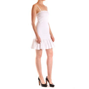 White mini dress with spaghetti straps, ideal for stylish summer occasions