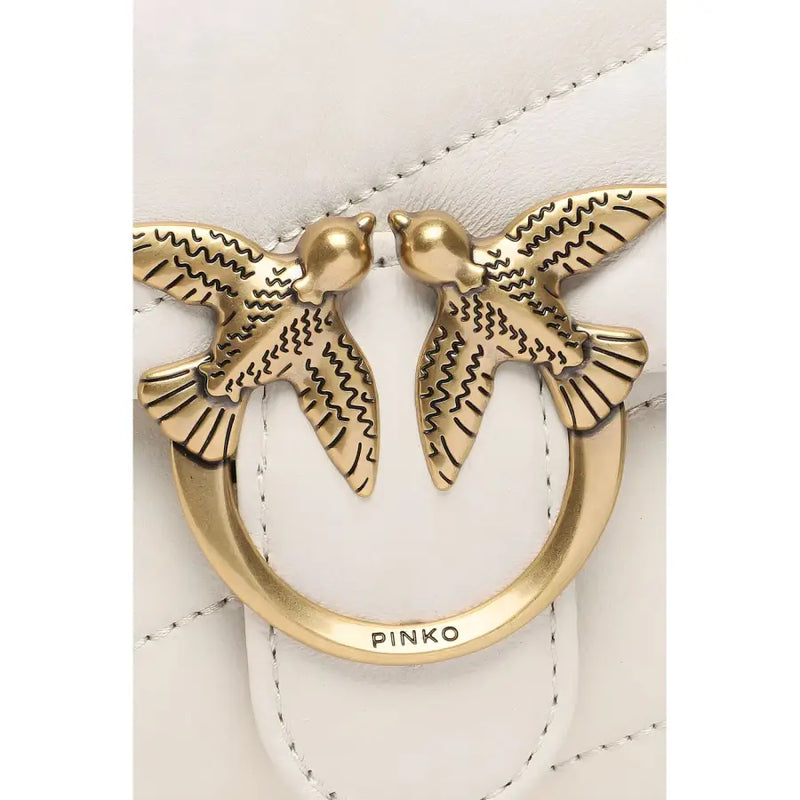 White Pinko handbag with gold-tone metal clasp featuring two detailed birds and white leather background with brand engraving