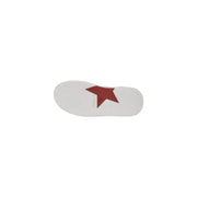 White platform sneaker sole with silver accents featuring a prominent red star emblem on the bottom side