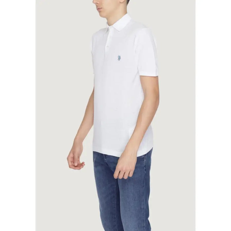 White polo shirt paired with blue jeans for a stylish casual look
