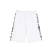 White athletic shorts featuring patterned zigzag side stripes for a stylish sports look