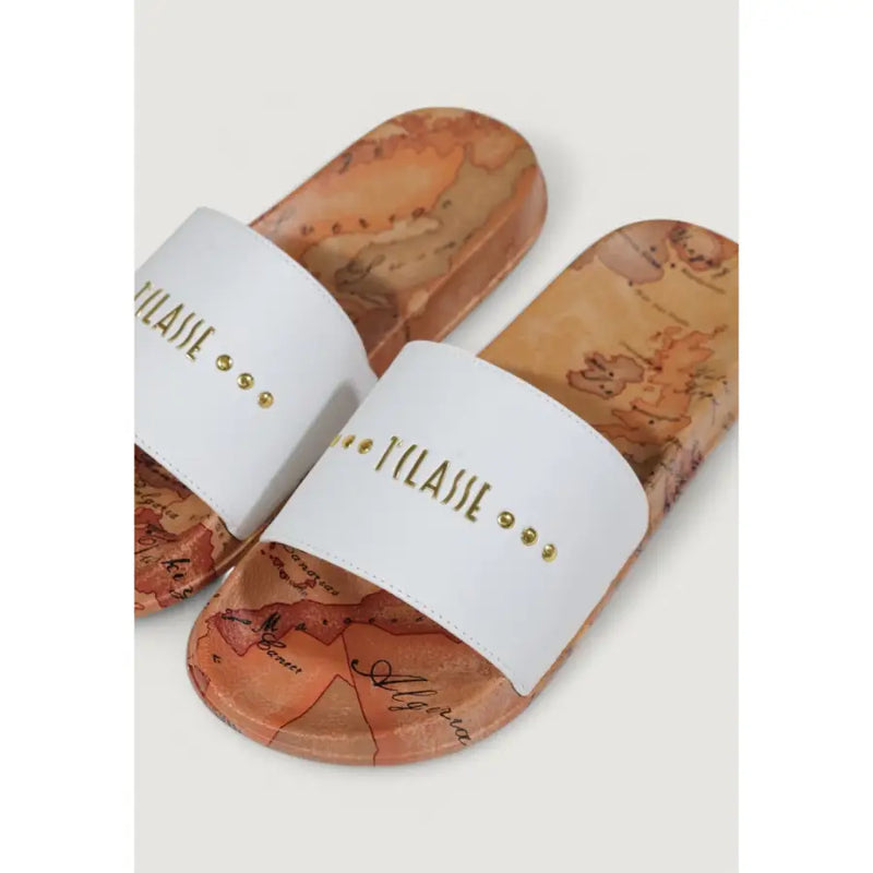 White slide sandal with cork sole featuring vintage map print in warm earth tones and gold lettering on the strap