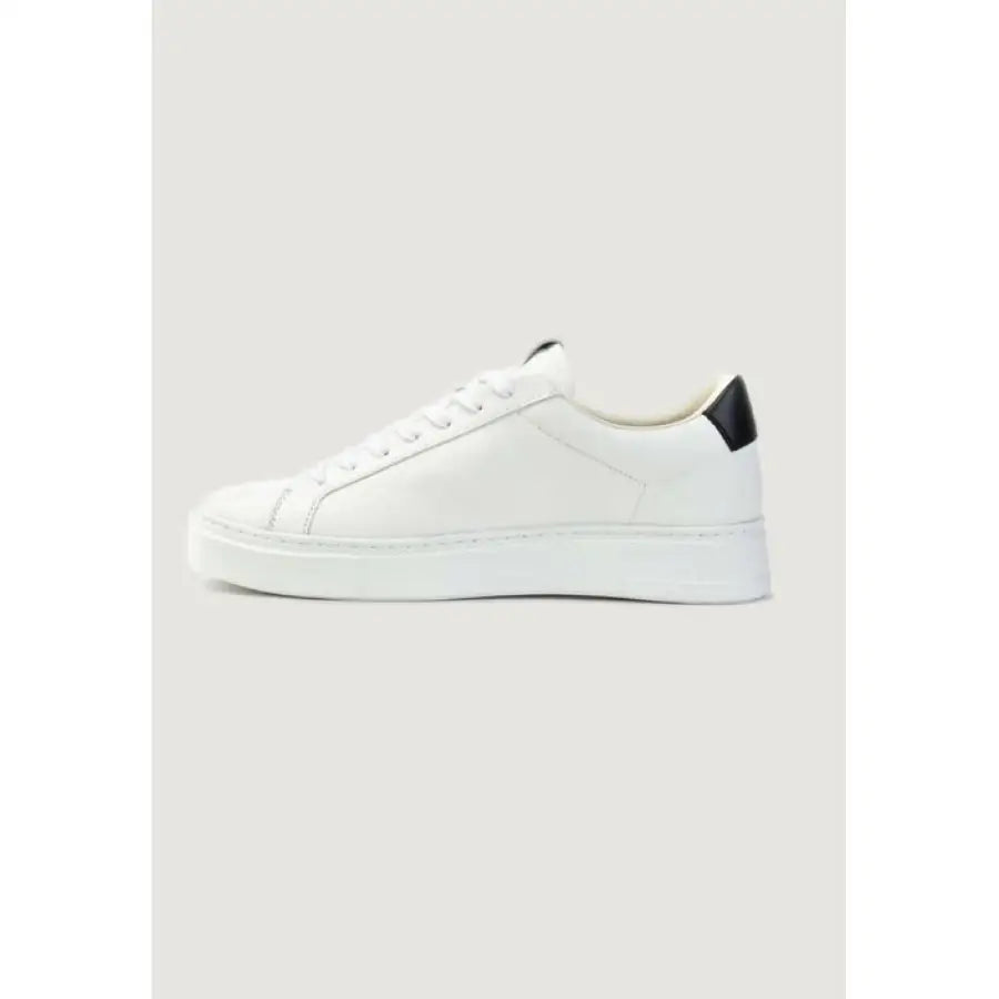 
                      
                        Crime London men sneakers in urban style clothing with a black sole on white sneaker
                      
                    