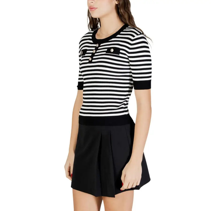 Black and white striped short sleeve knit top with round neck button placket and ribbed cuffs