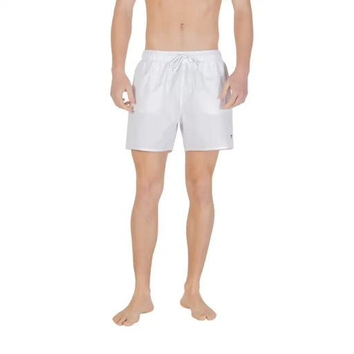 White swim trunks displayed in a product titled Black Swim Trunks for men’s swimwear