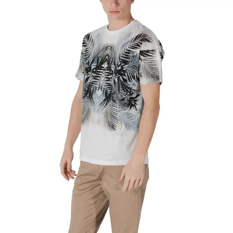 White t shirt with bold black and gray tropical palm leaf print fading to solid white at the bottom front side