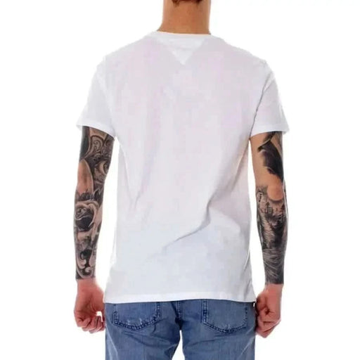 Tommy Hilfiger Men T-Shirt - White, modeled by a person with heavily tattooed arms