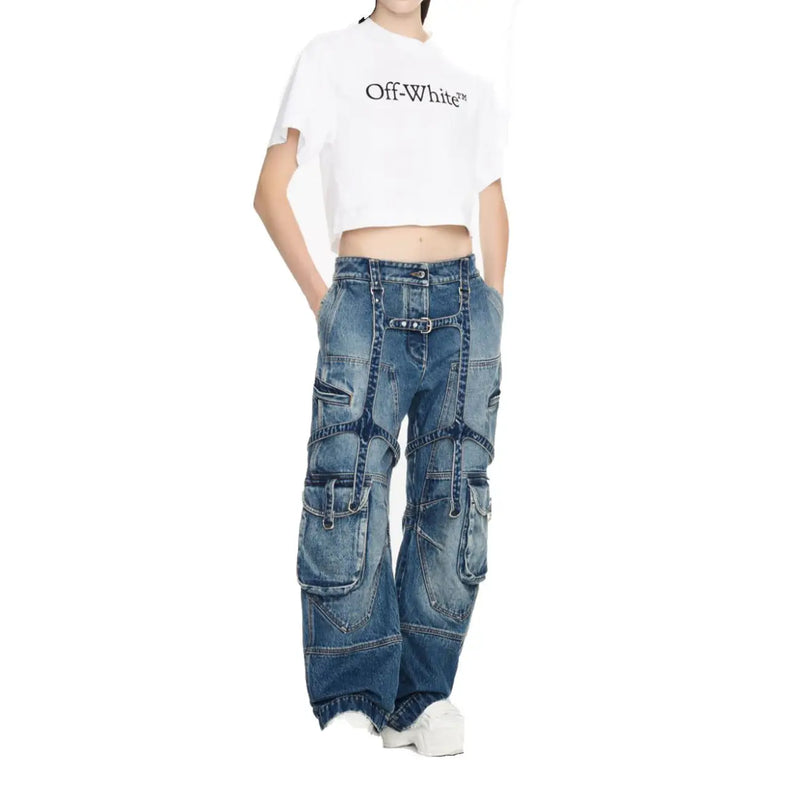 Off white women cotton jeans in blue denim with multiple cargo pockets belt buckle detail zip fly and distressed finish