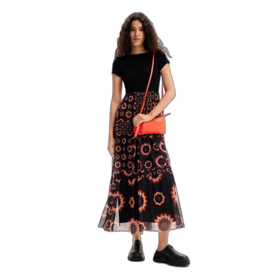 Urban style: woman in black dress with orange bag - Desigual Women Dress