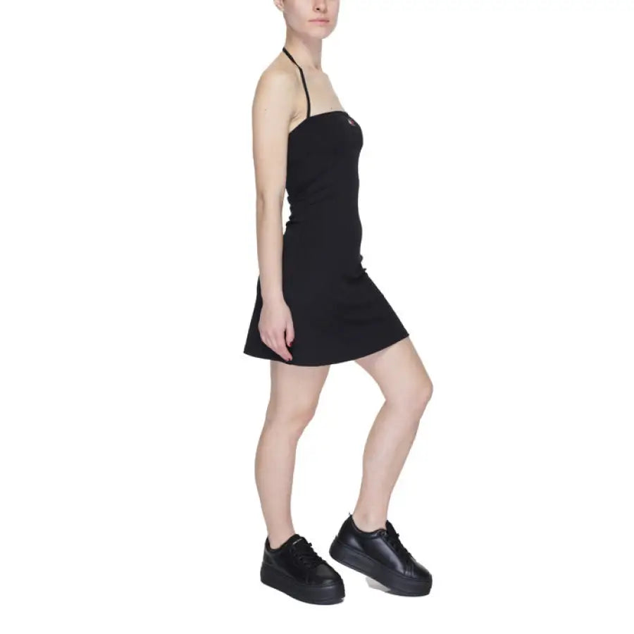 
                      
                        Woman in black dress and sneakers - Tommy Hilfiger Jeans Women Dress
                      
                    