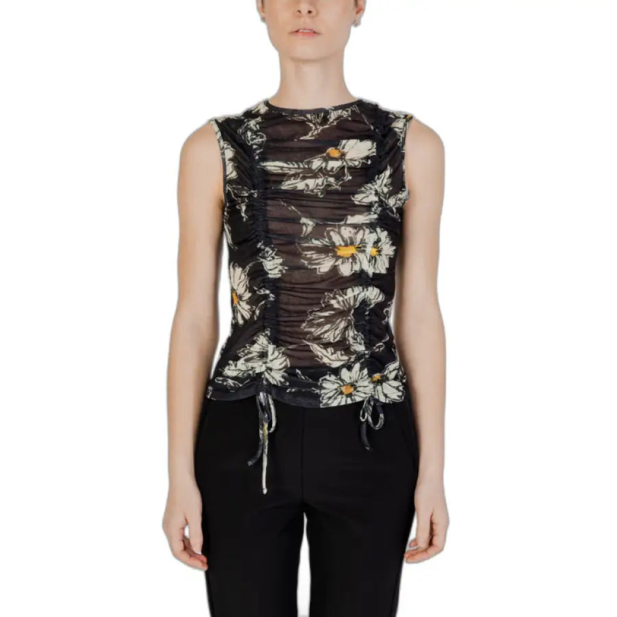 
                      
                        Desigual women wearing a black floral print Desigual undershirt
                      
                    
