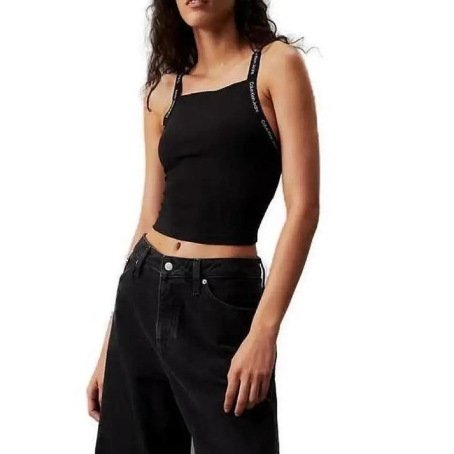 
                      
                        Woman wearing Calvin Klein jeans and crop top undershirt
                      
                    