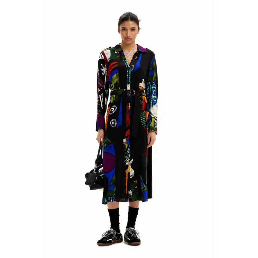 Urban style: A woman wearing a black and multi-colored coat - Desigual Women’s Dress