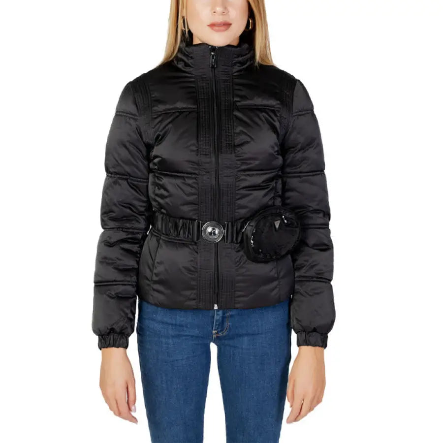 Guess Women’s Jacket: Urban style woman wearing a sleek black puffer jacket