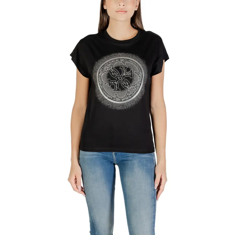 Woman wearing Guess Fall Winter white cotton round neck T shirt with silver graphic design