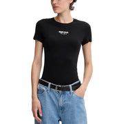 Woman wearing Tommy Hilfiger black organic cotton viscose round neck T shirt and light blue jeans