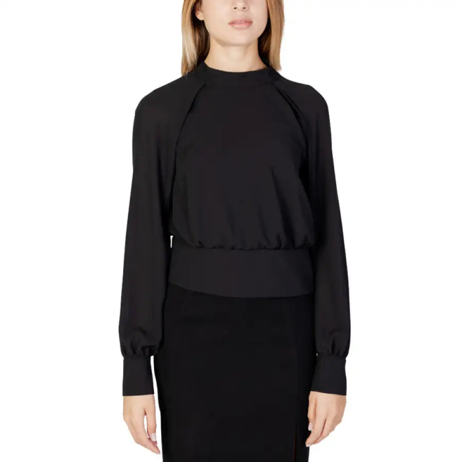 Woman in Sandro Ferrone black top and skirt, Sandro Ferrone Women Blouse feature