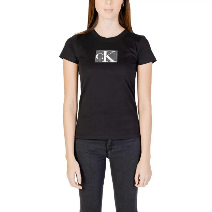 
                      
                        Calvin Klein Jeans - Woman in black t-shirt with logo for Calvin Klein women collection
                      
                    