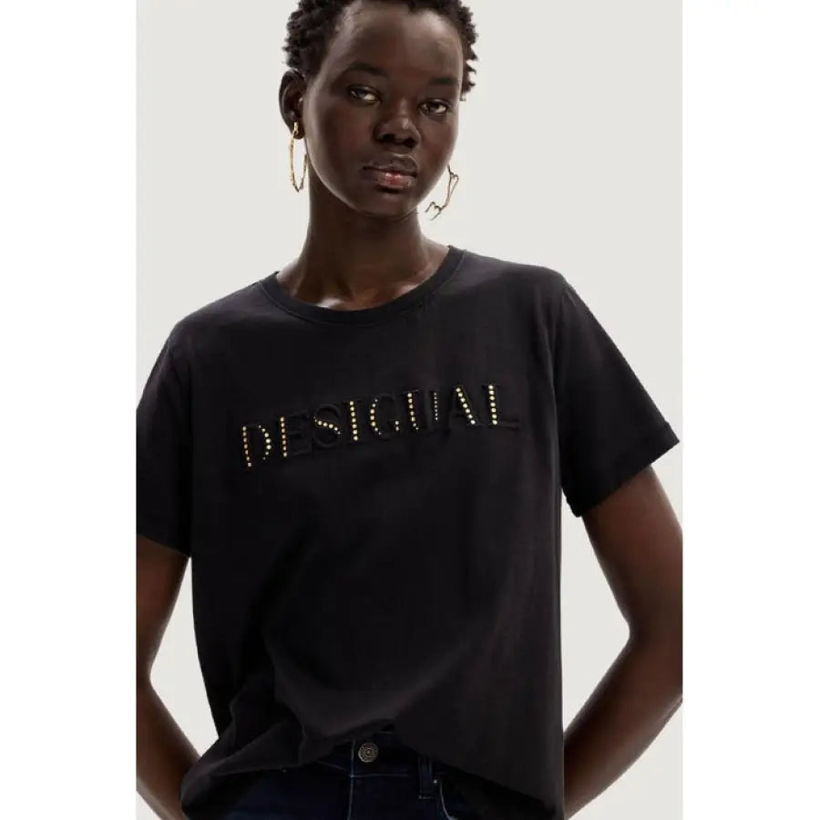 
                      
                        Desigual women t-shirt - woman in black with gold studs
                      
                    
