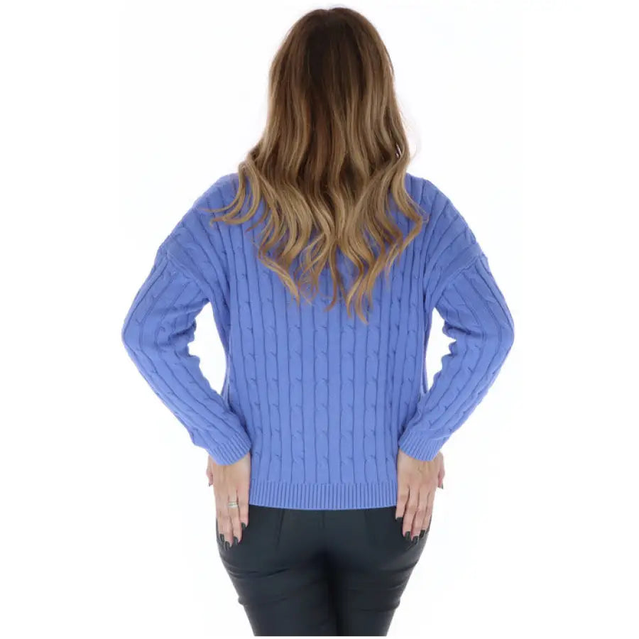 
                      
                        Woman in Superdry women knitwear, blue cable sweater
                      
                    