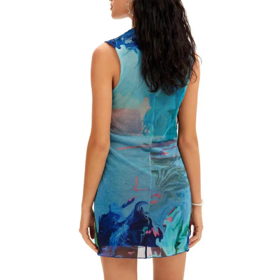 Urban style: Woman in Desigual dress, blue with colorful print