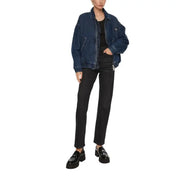 Woman wearing a denim jacket and black high-waisted denim jeans for women