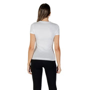 Woman wearing Guess White Printed Short Sleeve Round Neck T Shirt and black leggings