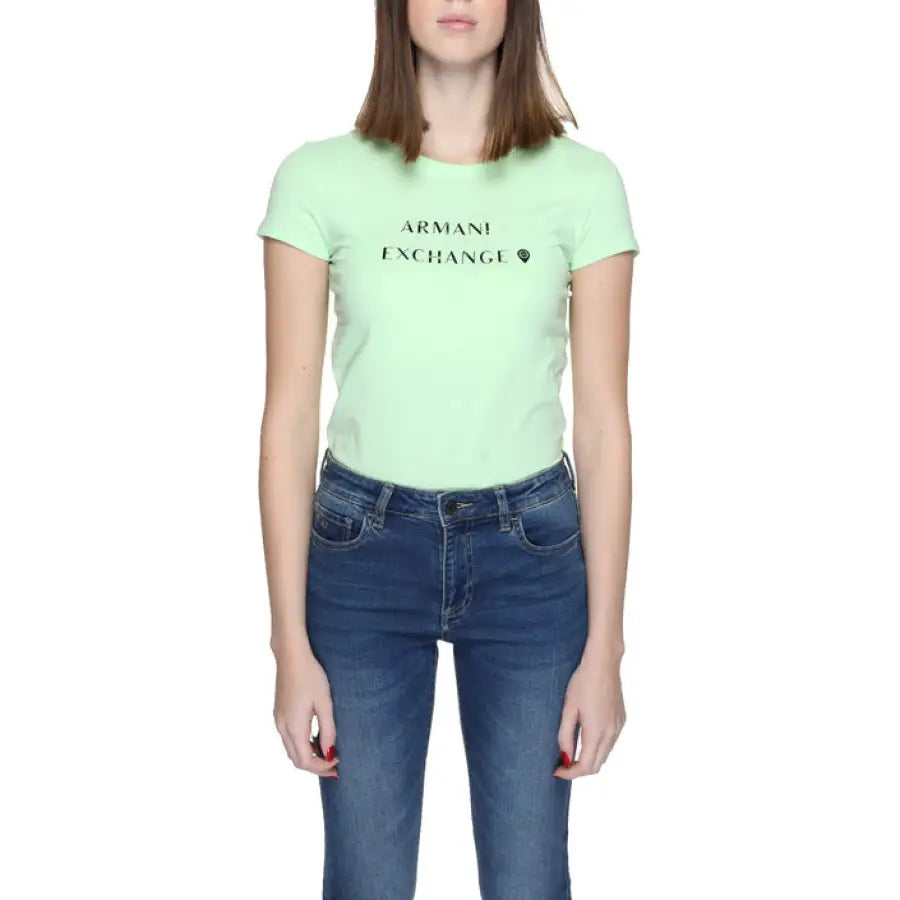 
                      
                        Armani Exchange women’s t-shirt in green with ’person’ text, showcasing urban city fashion
                      
                    