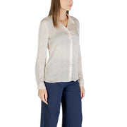 Woman wearing Beige Classic Long Sleeve Round Neck Shirt by Guess with dark blue trousers