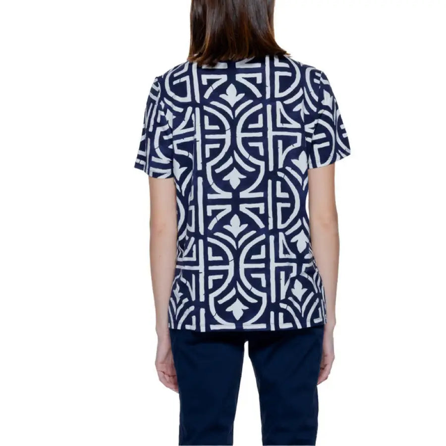 Woman in urban style navy and white patterned Street One blouse