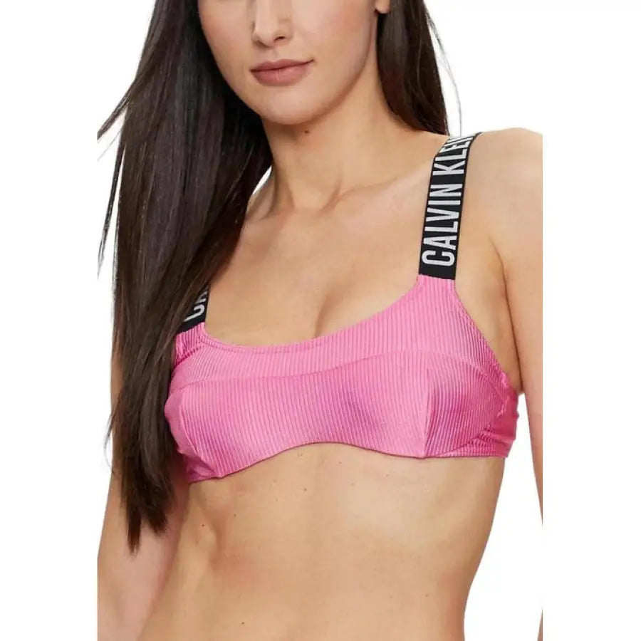 Urban chic: Woman in pink bikini top from Calvin Klein Women Beachwear collection