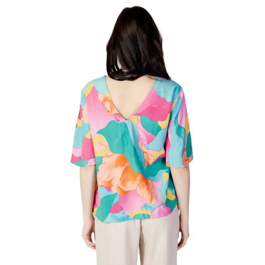 Woman in pink and green floral print top - Vila Clothes Urban Women Blouse