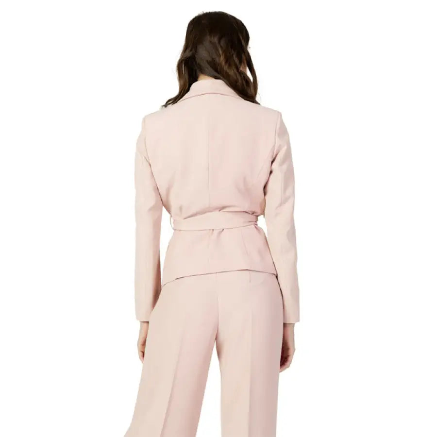 Woman in pink Sandro Ferrone blazer - urban chic style