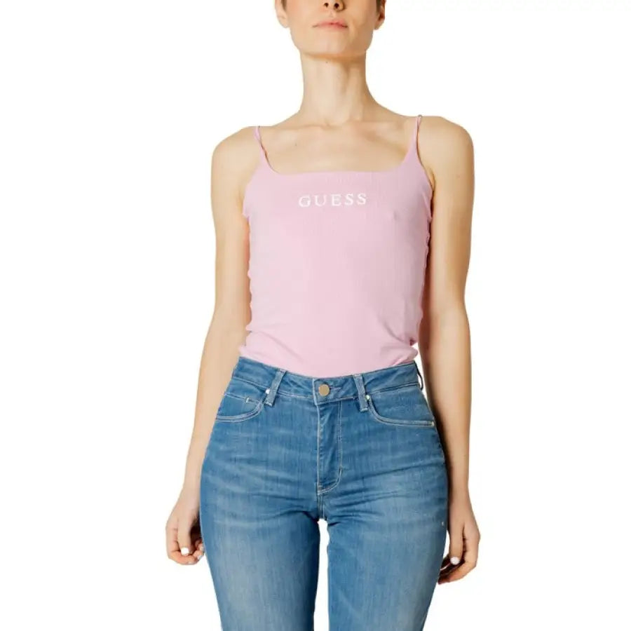 
                      
                        Woman wearing Guess Active pink tank top for Guess Active Women Undershirt series
                      
                    